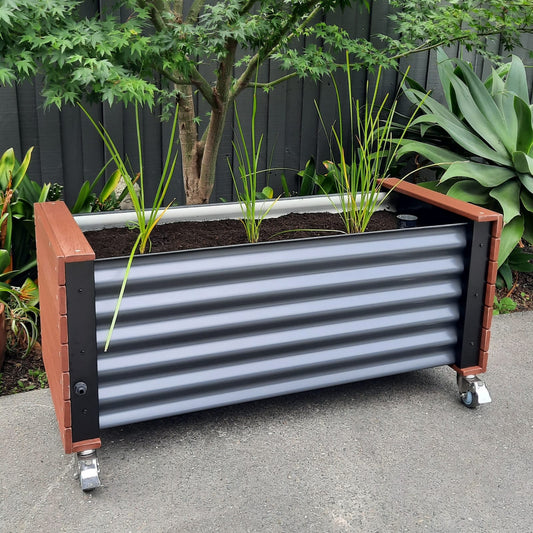 Artesian Range Eco Board Wicking Planter Box featuring innovative WaterUps technology—an Australian-designed, eco-friendly planter built with 92% recyclable materials. Ideal for sustainable gardening, it saves water (80% less watering) while boosting yield (30% more), perfect for balconies, courtyards, and garden spaces